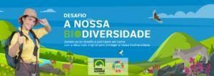 Jovem em equipamento de exploração numa paisagem verde com animais e texto 'Desafio A Nossa Biodiversidade'